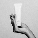 LBH Skincare Exfoliating Mask white tube in hand