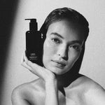 LBH Skincare Exfoliating Toner black bottle with model