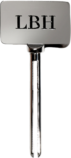 Metallic tube key with LBH initials