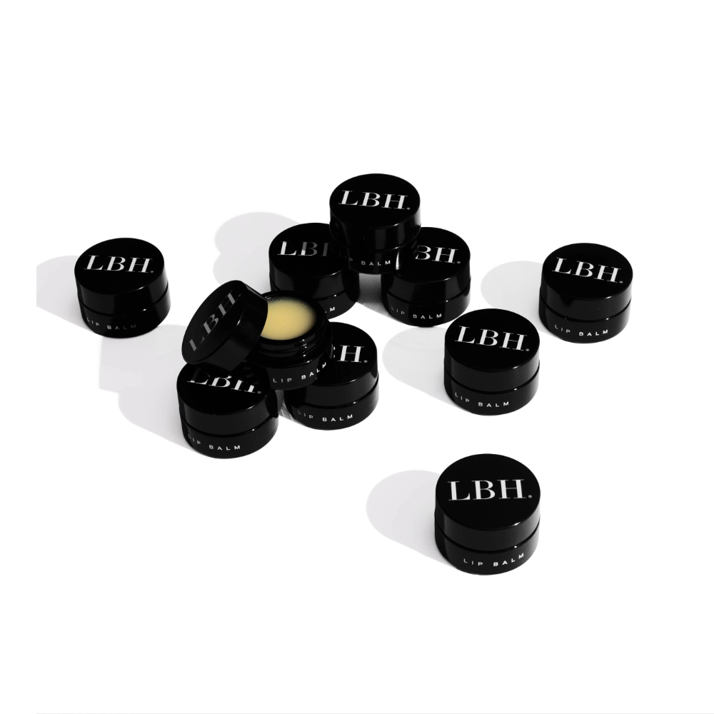 LBH Skincare Lip Balm - Collection of black LBH lip balms on a white background