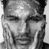 Model cleansing face with LBH Skincare AHA Cleanser