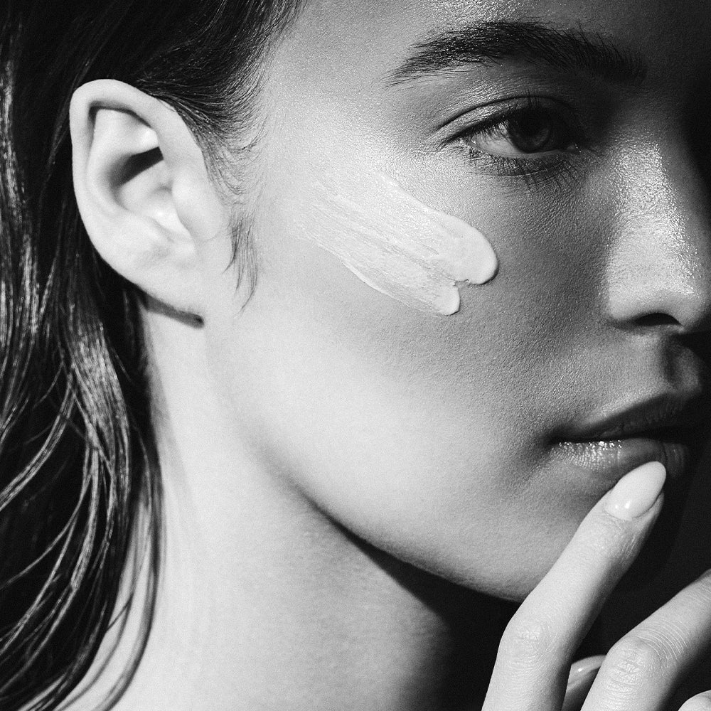 Model wearing LBH Skincare Exfoliating Mask on the face